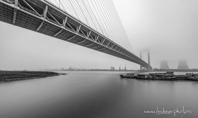 Maybe not one of the prominent photo spots in Shanghai, the Minpu bridge, here hidden in grey Shanghai morning, is a quite impressive suspension bridge. 
