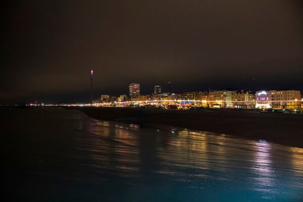 Brighton seafront at night seen from the Palace Pier.