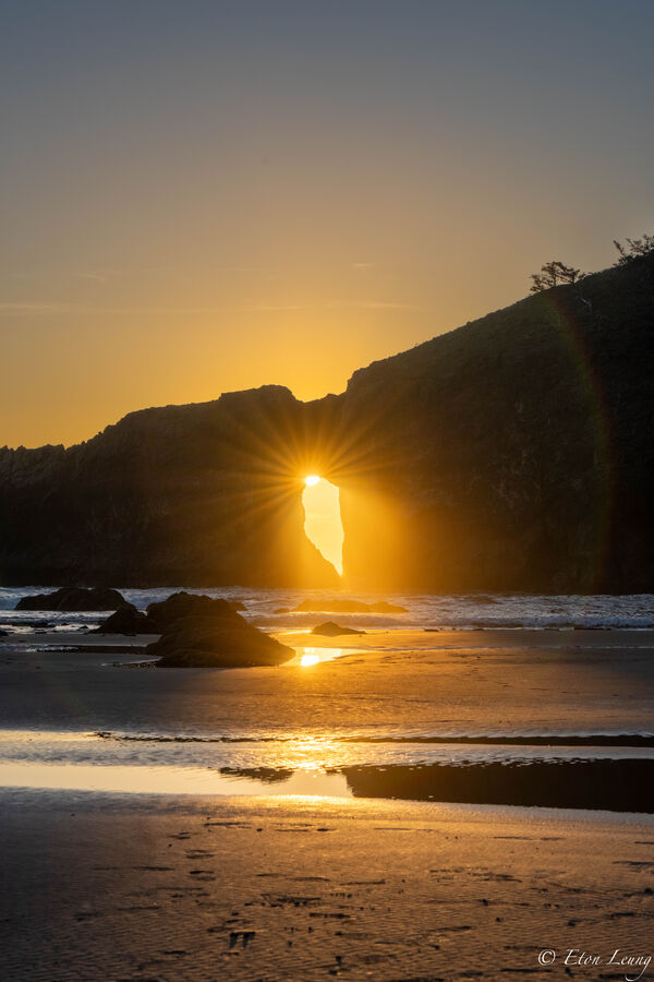 Sun ray coming through the hole in the wall during sunset.